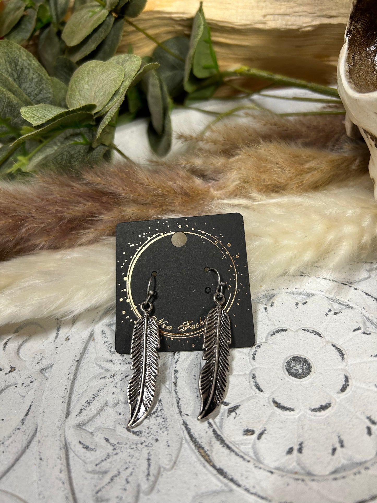 Silver feather earrings